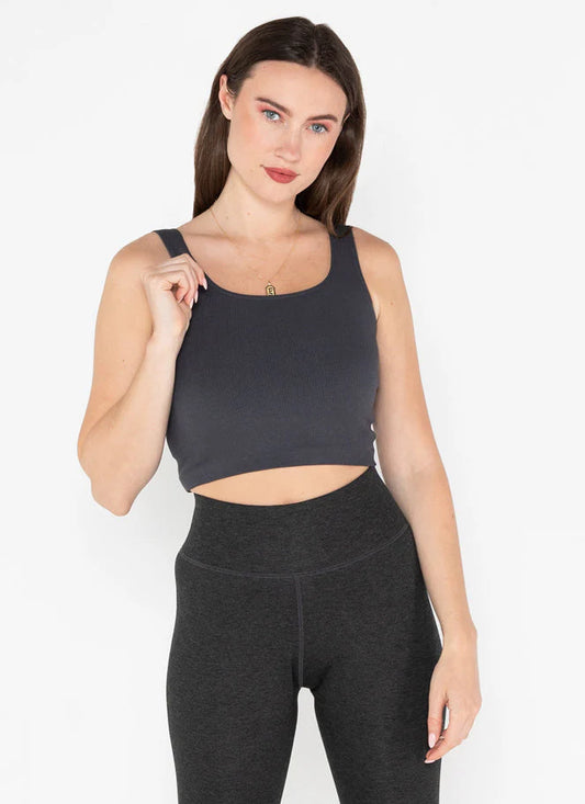 Woman wearing Câ€™est Moi bamboo ribbed square neck tank top in lead